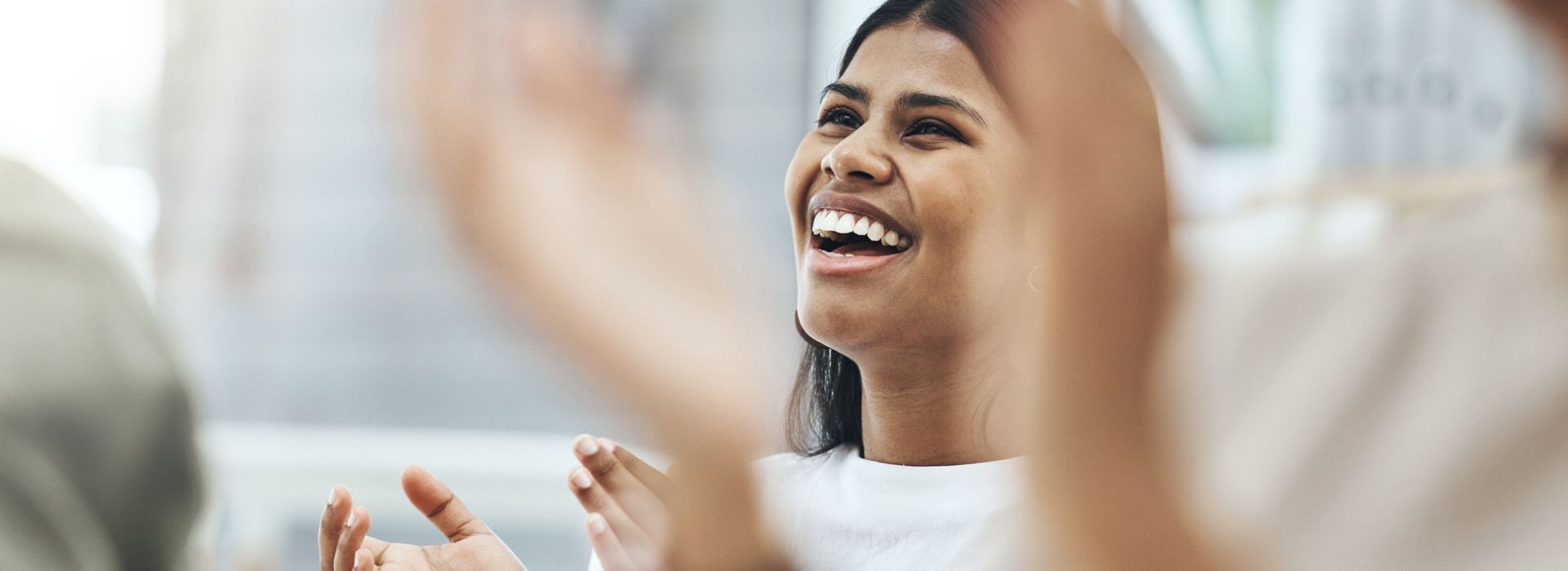 Employees clapping and smiling