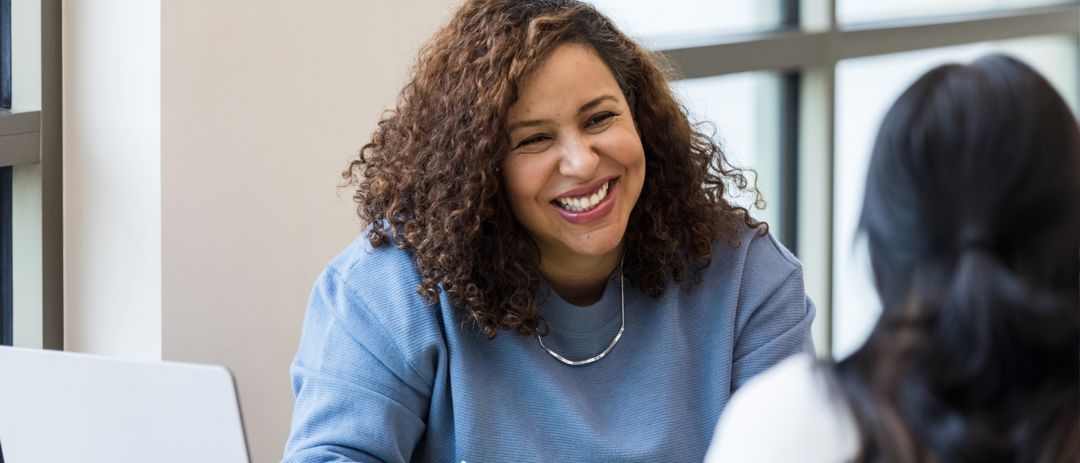 woman working in the alternative lending industry smiling